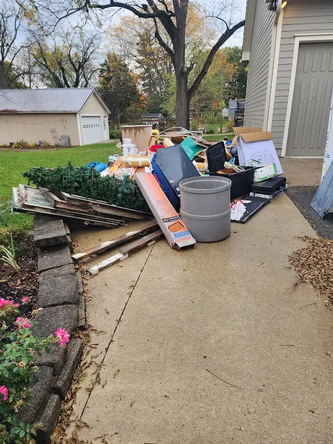 Dumpster being loaded with debris for Commercial Dumpster Rental in Hot Springs